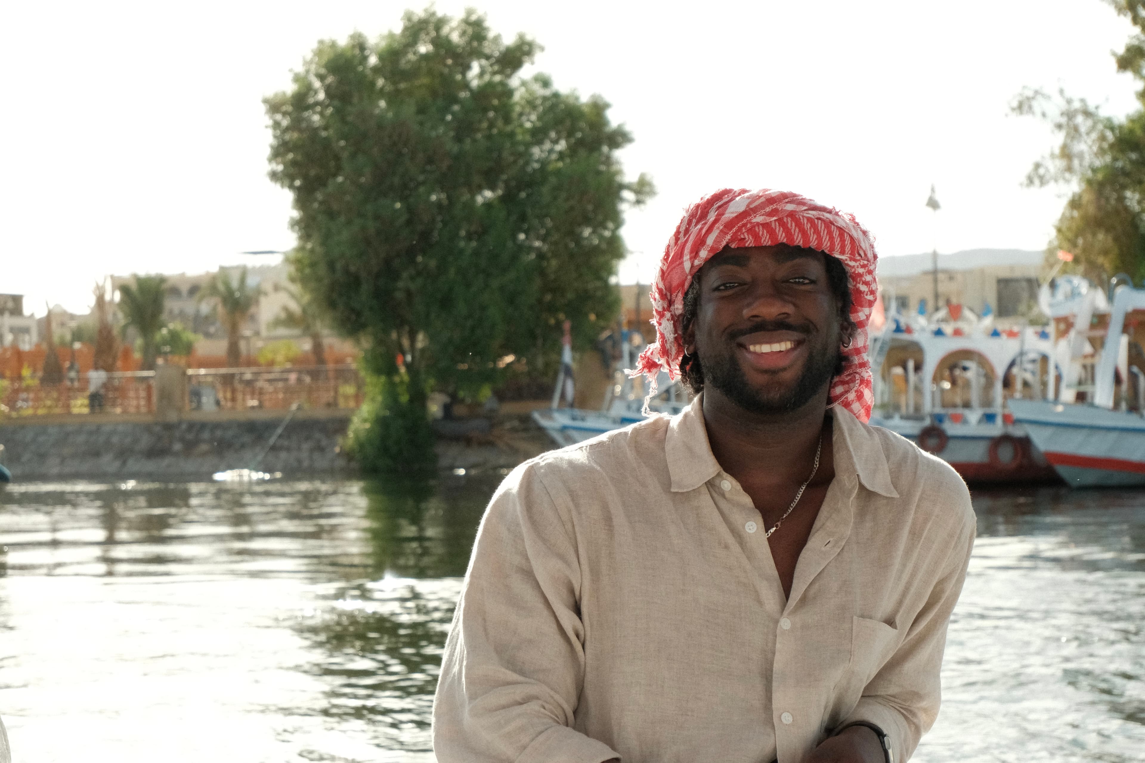 Steiner Abayie smiling beside the water